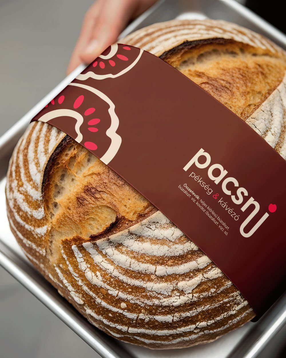 Pacsni sourdough loaf with a branded wrap
